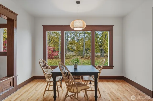 a view of a dining room with furniture window and outside view