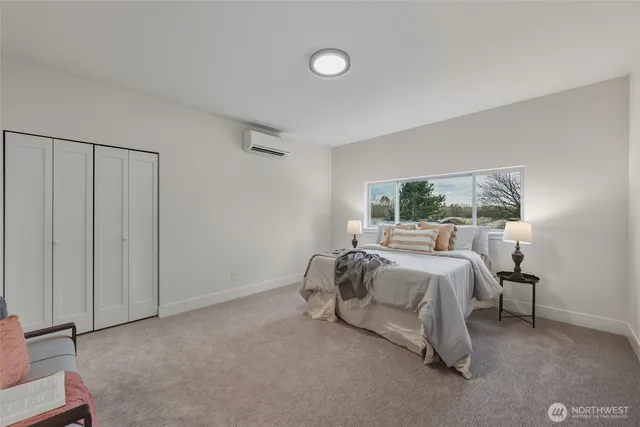 a bed room with a bed and a window