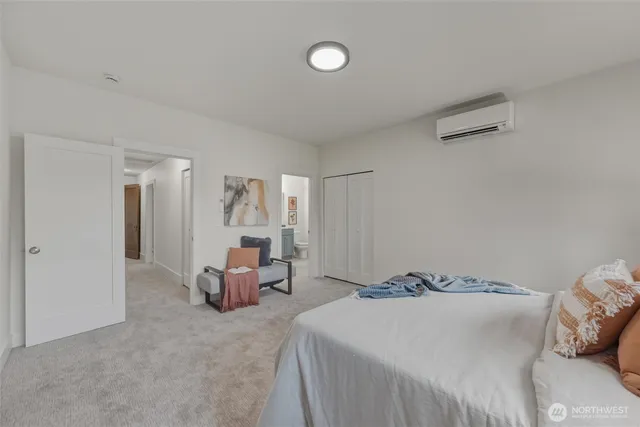 a bedroom with a bed and chair