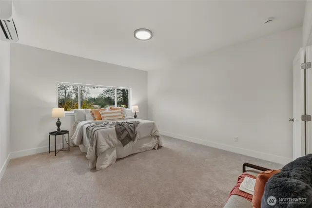 a bed room with a bed and a window