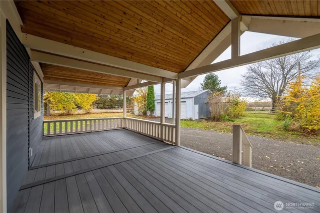 a view of a porch with wooden floor