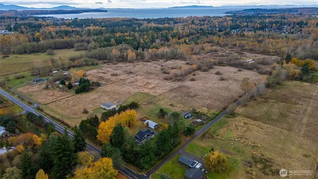 an aerial view of house with a yard