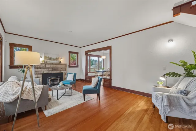 a living room with furniture and fireplace
