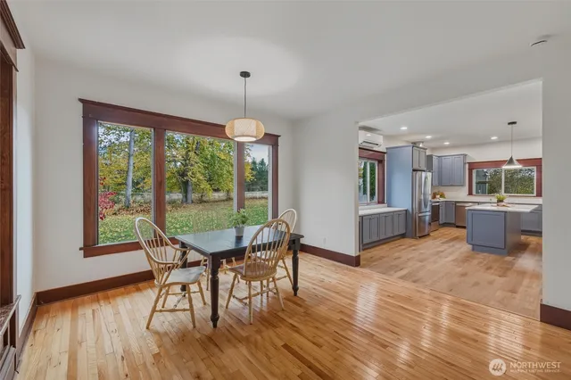a view of a dining room with furniture window and wooden floor