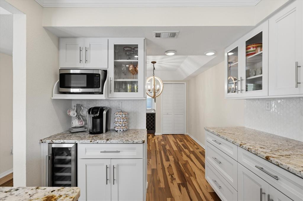 9170 Blind Pass Road St. Pete Beach, FL 33706 - Photo 16 of 58 a kitchen with a stove and a microwave