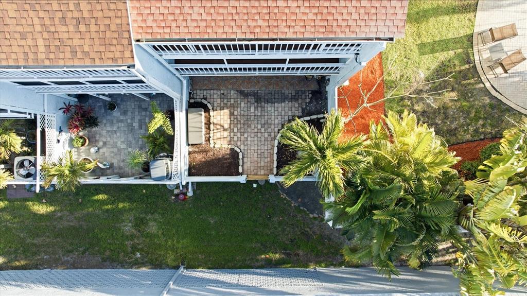 9170 Blind Pass Road St. Pete Beach, FL 33706 - Photo 44 of 58 a view of a house with a porch