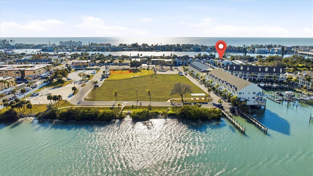 9170 Blind Pass Road St. Pete Beach, FL 33706 - Photo 46 of 58 swimming pool view with a lake view