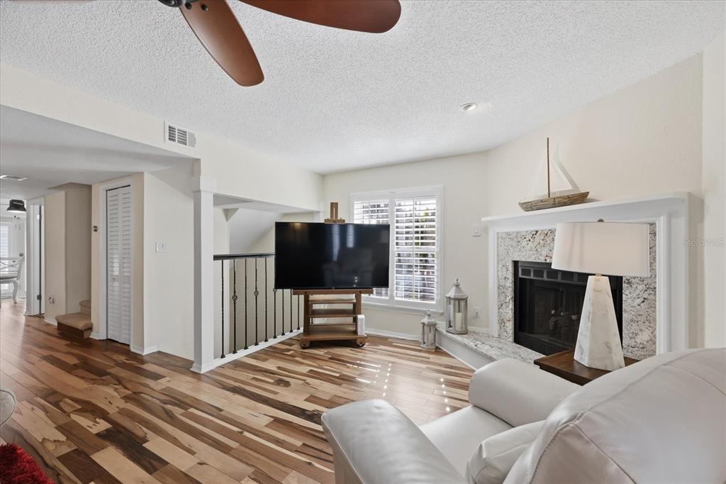 9170 Blind Pass Road St. Pete Beach, FL 33706 - Photo 10 of 58 a bedroom with furniture and a flat screen tv