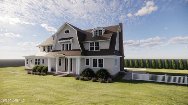 a front view of a house with a yard table and chairs