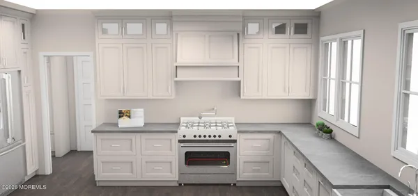 a kitchen with granite countertop white cabinets and stainless steel appliances