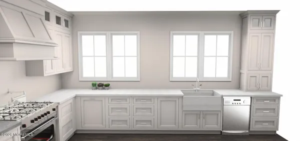 a kitchen with white cabinets and window