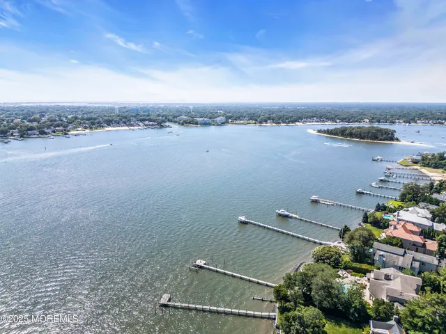 an aerial view of a houses with lake view
