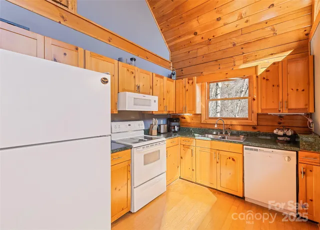 a view of a patio with a couch and wooden fence