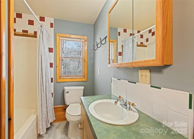 a bedroom with a bed and furniture