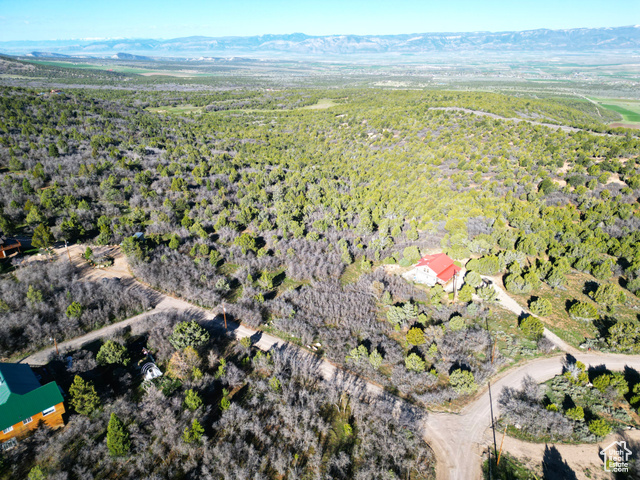 14050 Oak Rdg Circle, Unit 144 Mount Pleasant, UT 84647 - Photo 4 of 28 Aerial view of property's location with a heavily wooded area and a mountainous background