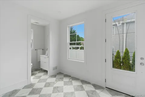 a view of a bathroom with a shower and a sink