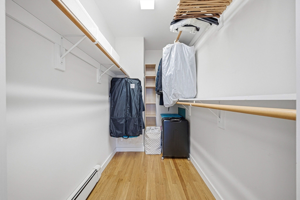 190 Prospect Street, Unit 8 Cambridge, MA 02139 - Photo 20 of 32 a view of walk in closet with clothes