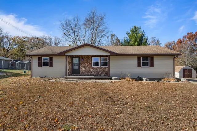 a house with trees in the background