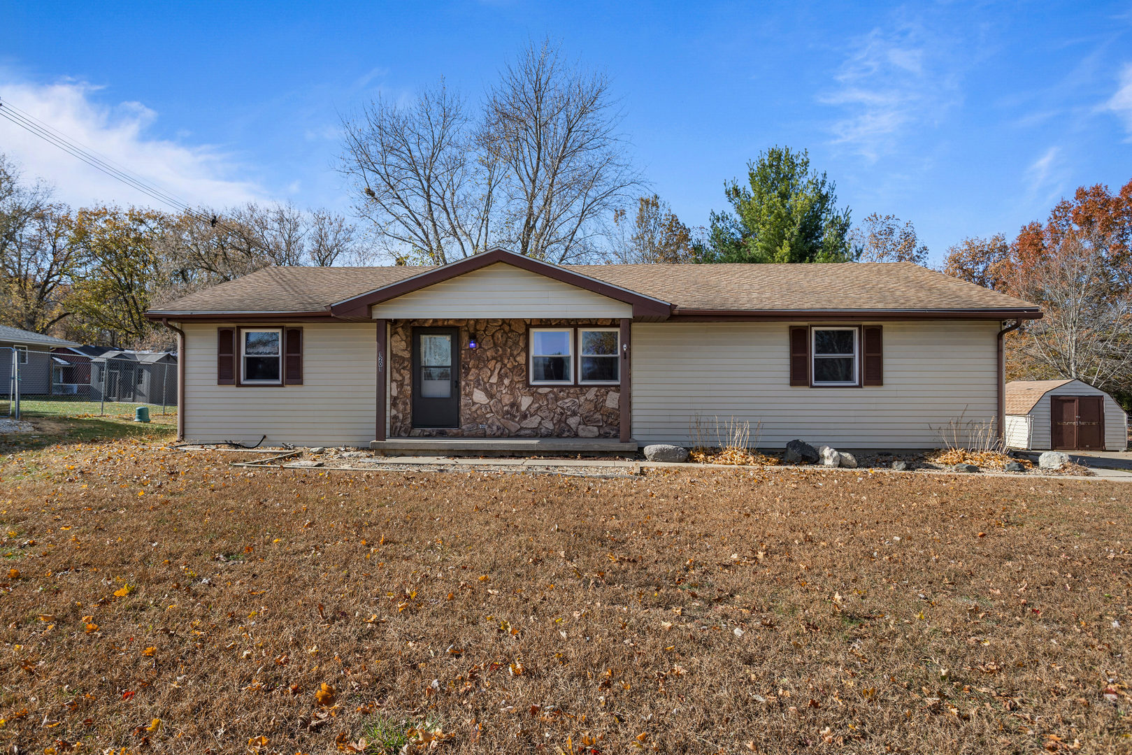 a house with trees in the background
