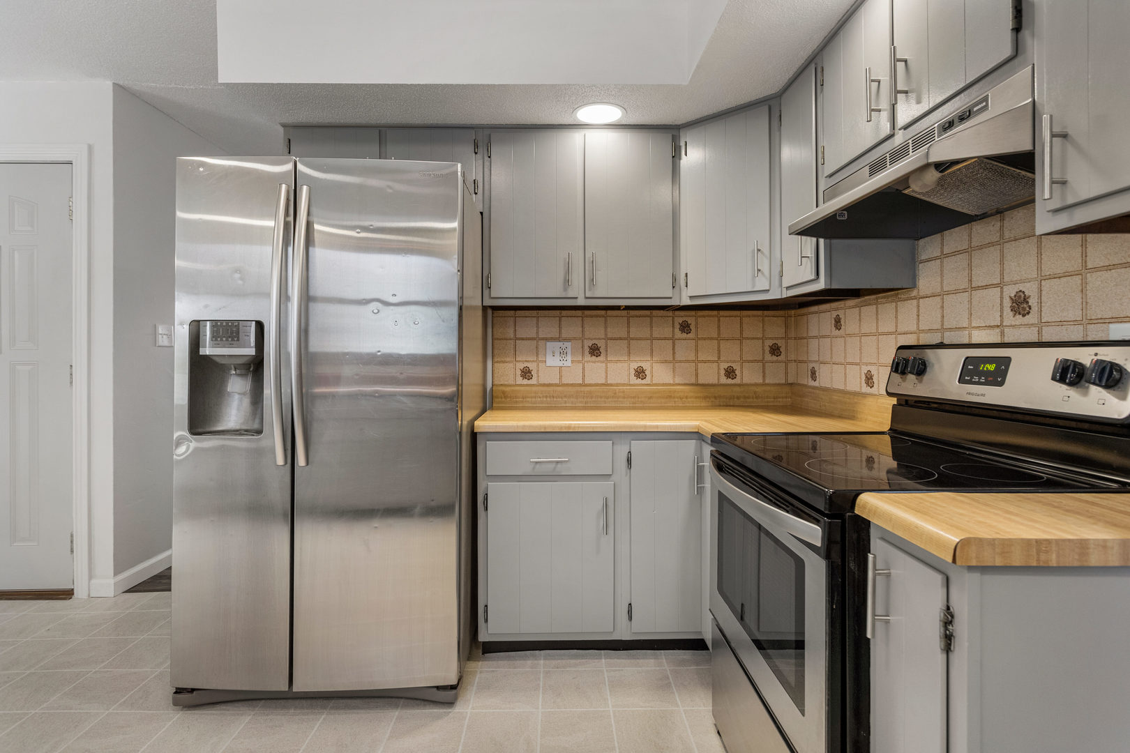 1201 Robin Road Mahomet, IL 61853 - Photo 11 of 33 a kitchen with a refrigerator sink and cabinets