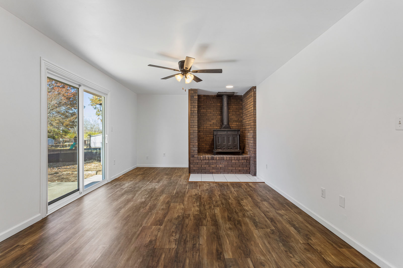 1201 Robin Road Mahomet, IL 61853 - Photo 14 of 33 wooden floor in an empty room with a window