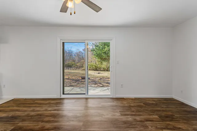 a view of room with window and hardwood floor