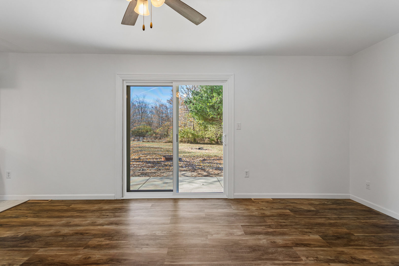 1201 Robin Road Mahomet, IL 61853 - Photo 15 of 33 a view of room with window and hardwood floor