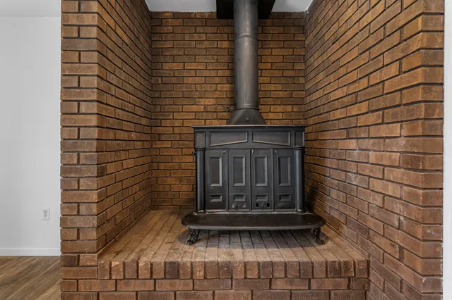 a bathroom with a granite countertop toilet and sink