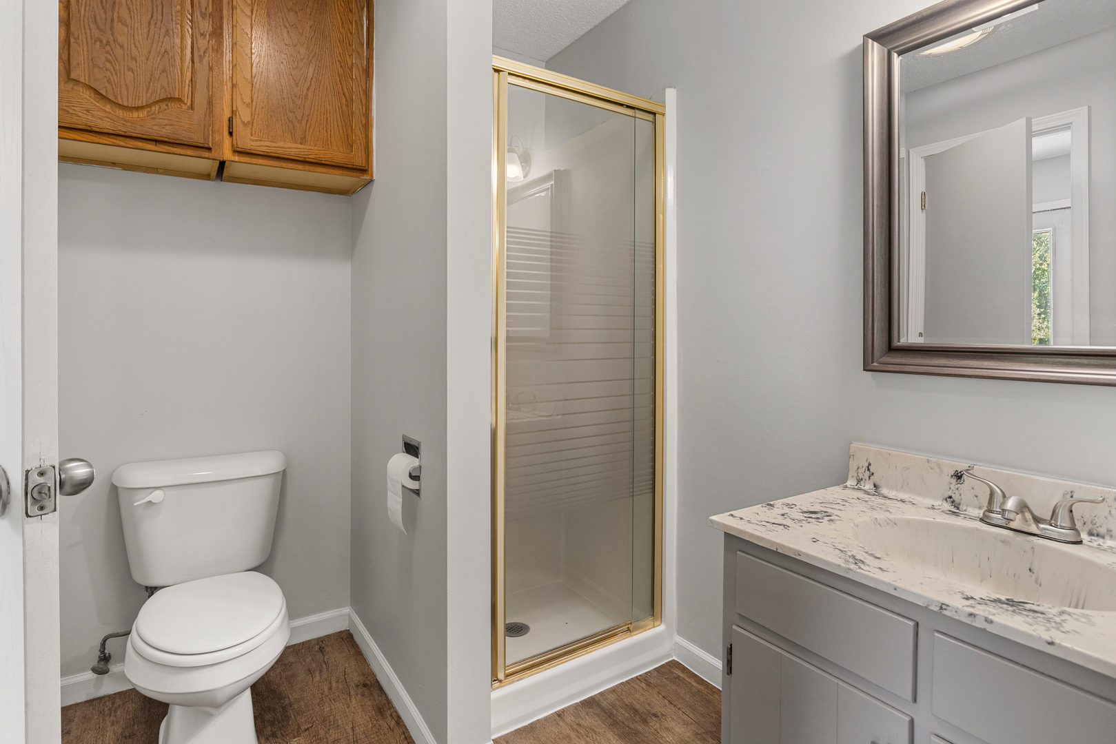 1201 Robin Road Mahomet, IL 61853 - Photo 18 of 33 a bathroom with a granite countertop toilet and sink