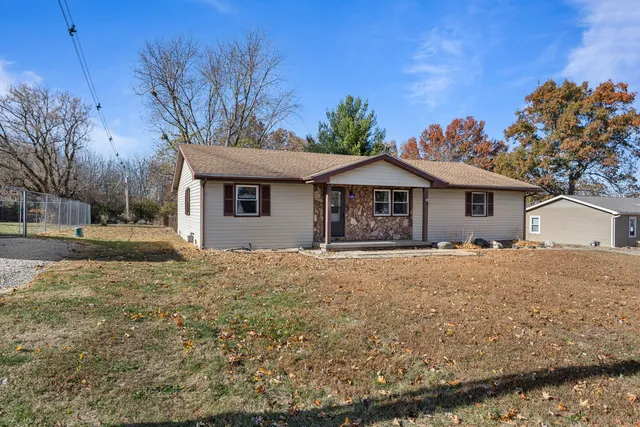 a house with trees in the background