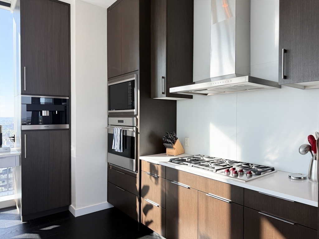 188 Brookline Avenue, Unit PH29A Boston, MA 02215 - Photo 11 of 42 a kitchen with stainless steel appliances granite countertop a refrigerator and a stove
