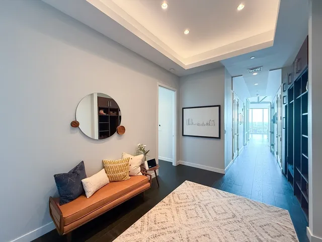 a bedroom with a bed and a couch