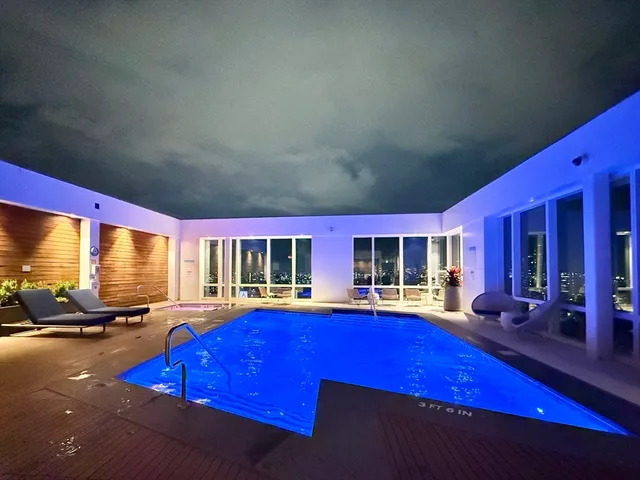 a view of a backyard with sitting area