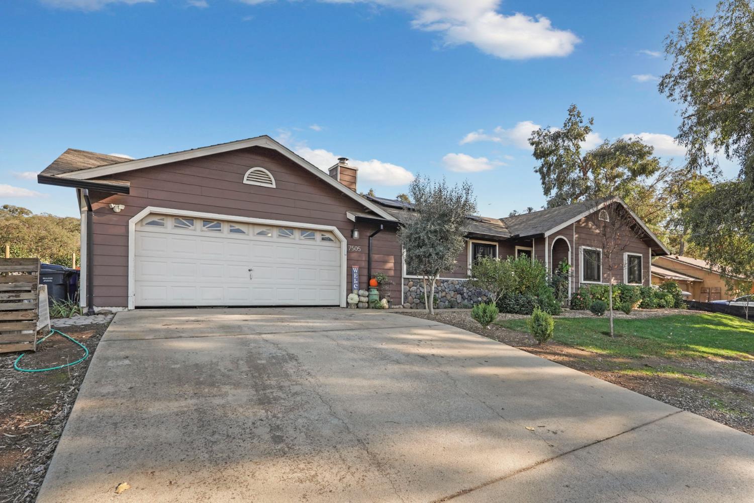 7505 Baldwin Street Valley Springs, CA 95252 - Photo 44 of 45 a front view of a house with a yard and garage