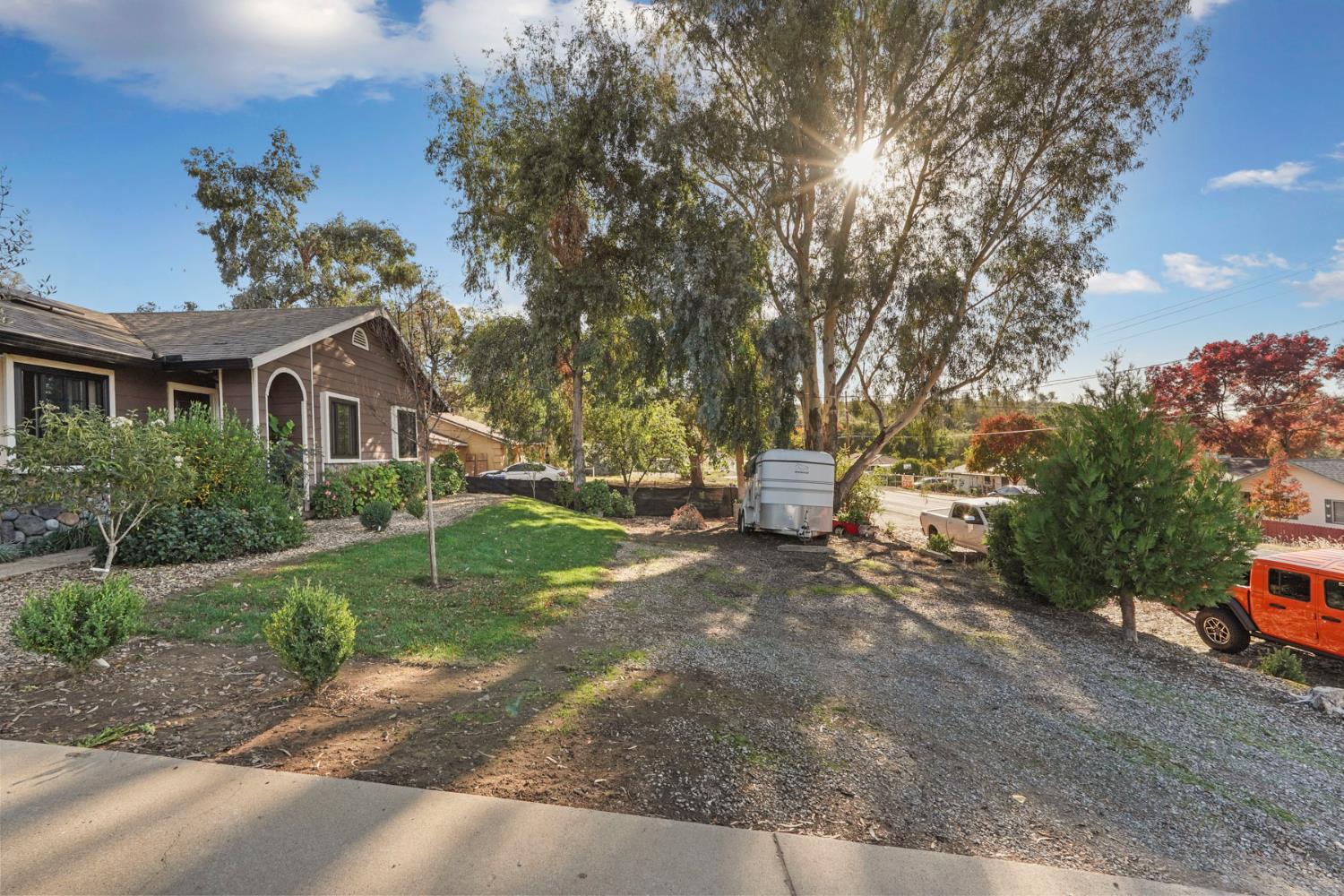 7505 Baldwin Street Valley Springs, CA 95252 - Photo 5 of 45 a view of a house with a backyard
