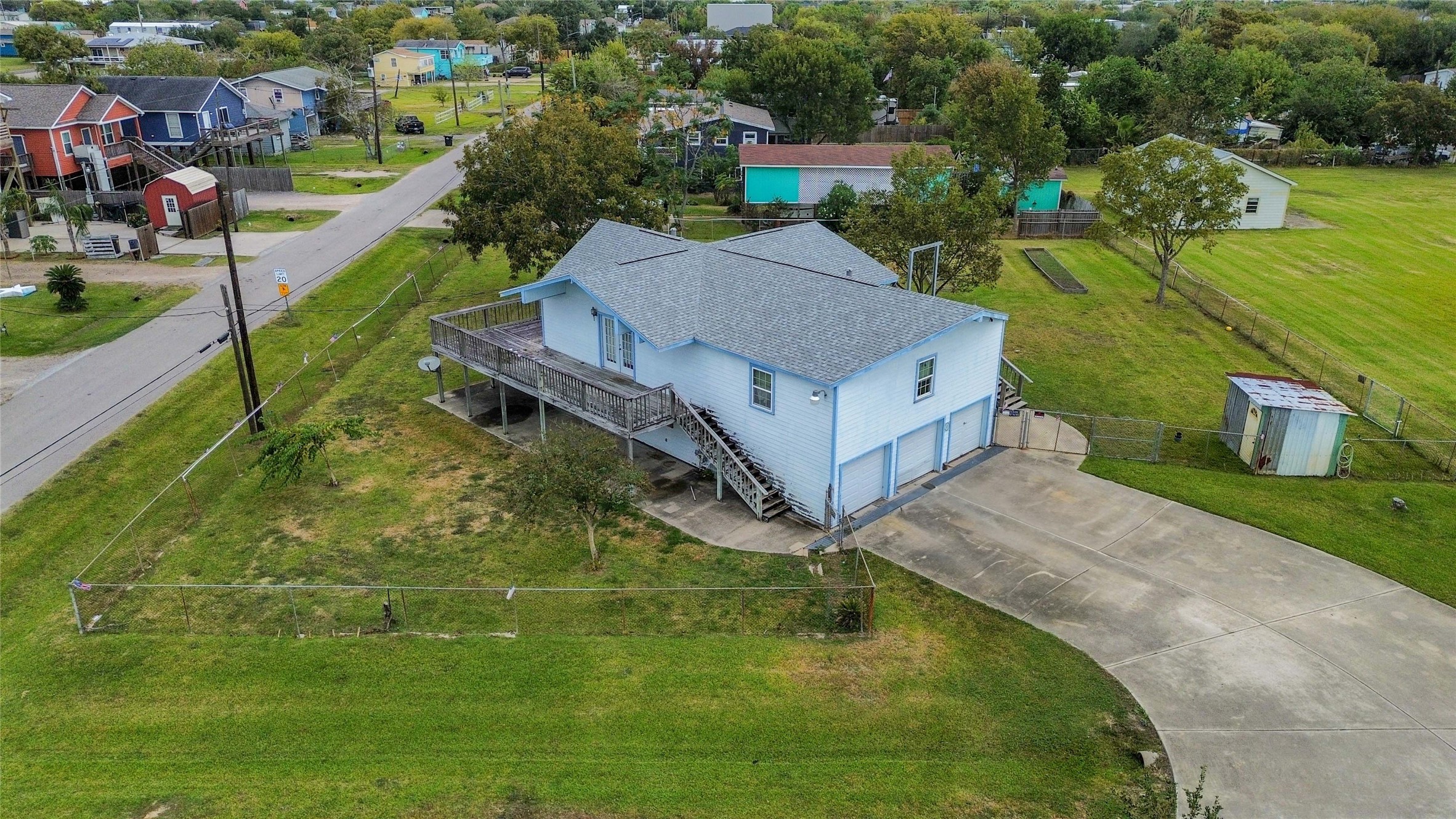 a aerial view of a house with a yard