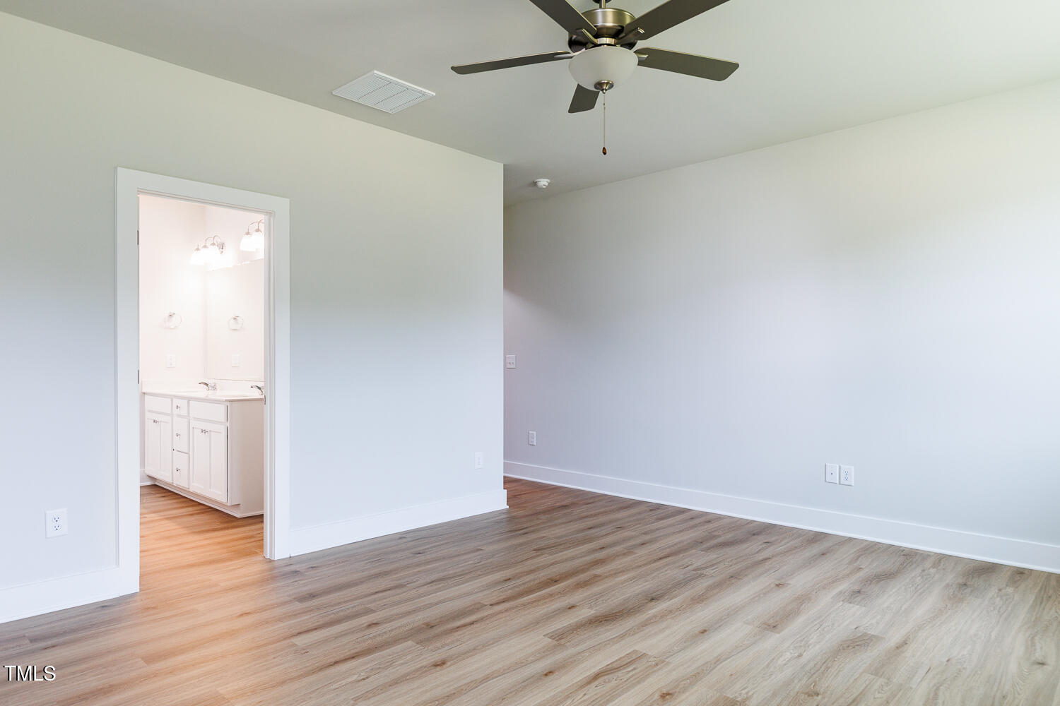 207 Golfview Avenue Four Oaks, NC 27524 - Photo 12 of 37 an empty room with wooden floor and windows