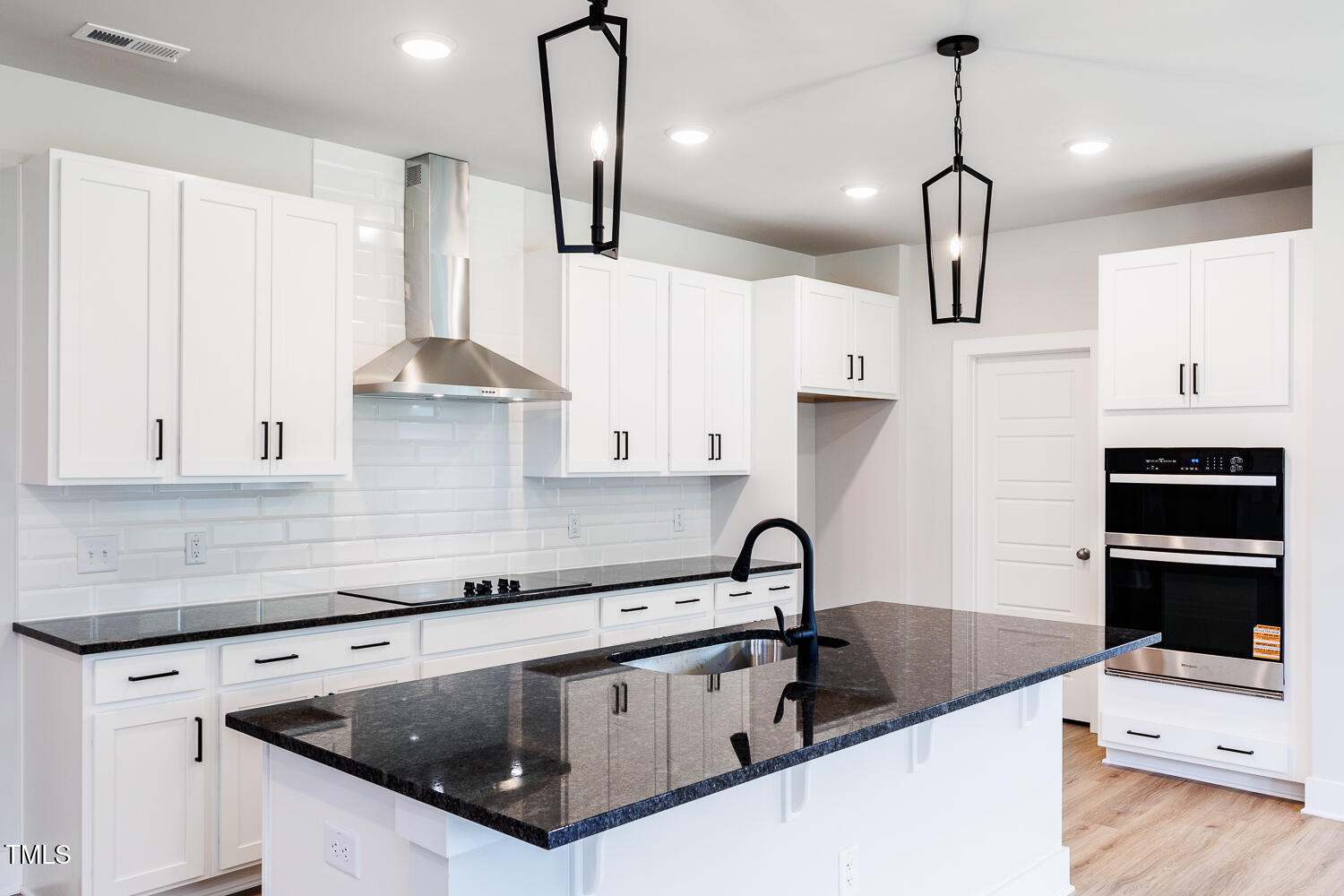 207 Golfview Avenue Four Oaks, NC 27524 - Photo 21 of 37 a kitchen with stainless steel appliances granite countertop a sink a stove and a refrigerator