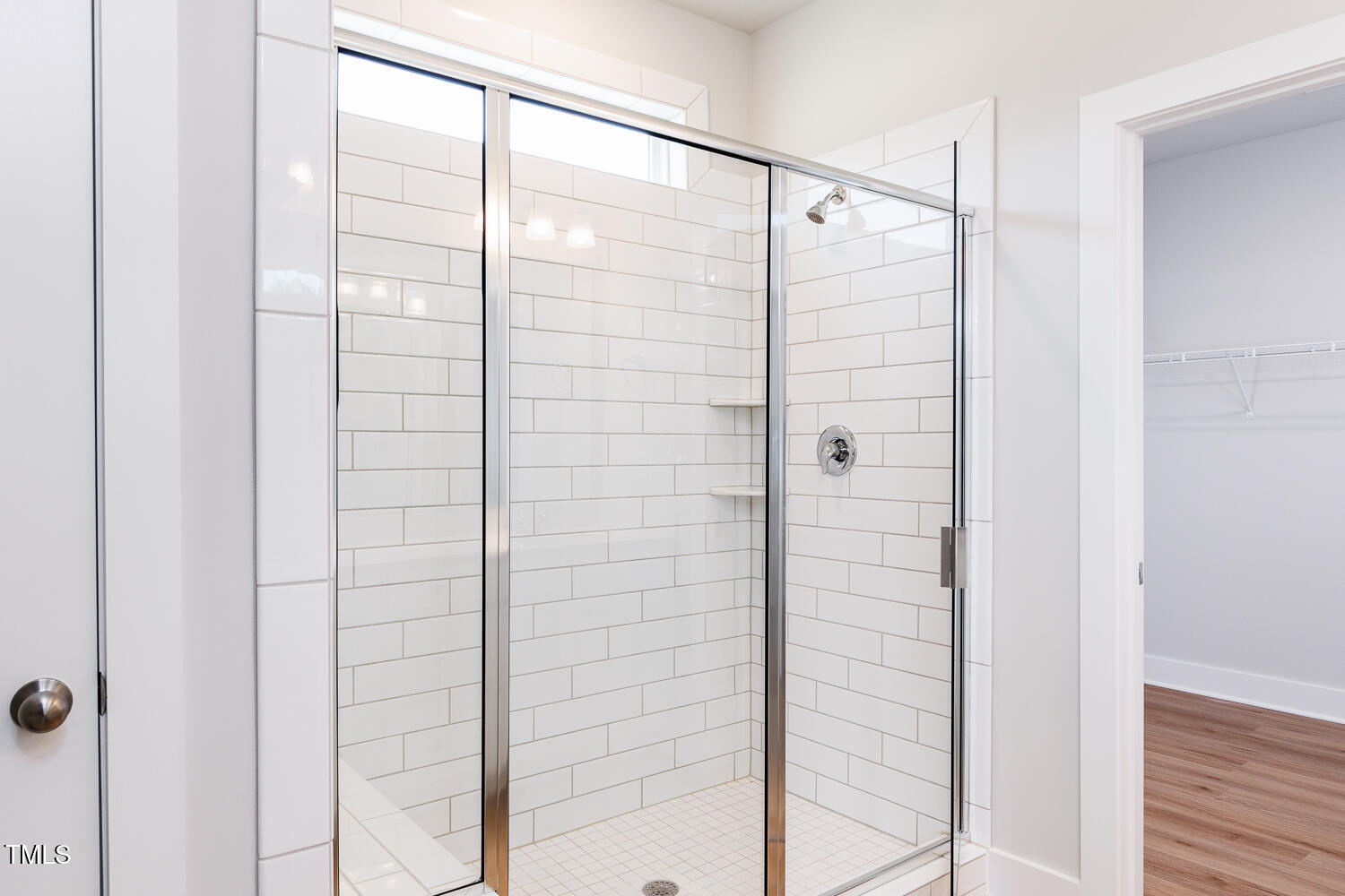207 Golfview Avenue Four Oaks, NC 27524 - Photo 25 of 37 a bathroom with a glass shower door