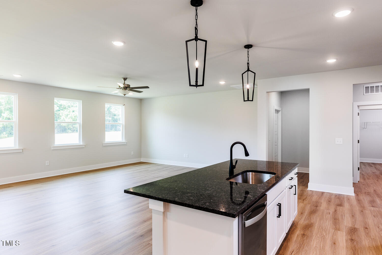 207 Golfview Avenue Four Oaks, NC 27524 - Photo 7 of 37 a kitchen with a sink and chandelier