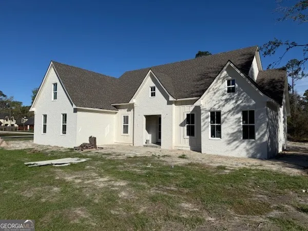 a front view of a house with a yard