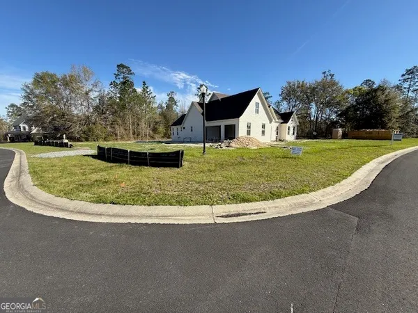 a view of a house with a big yard