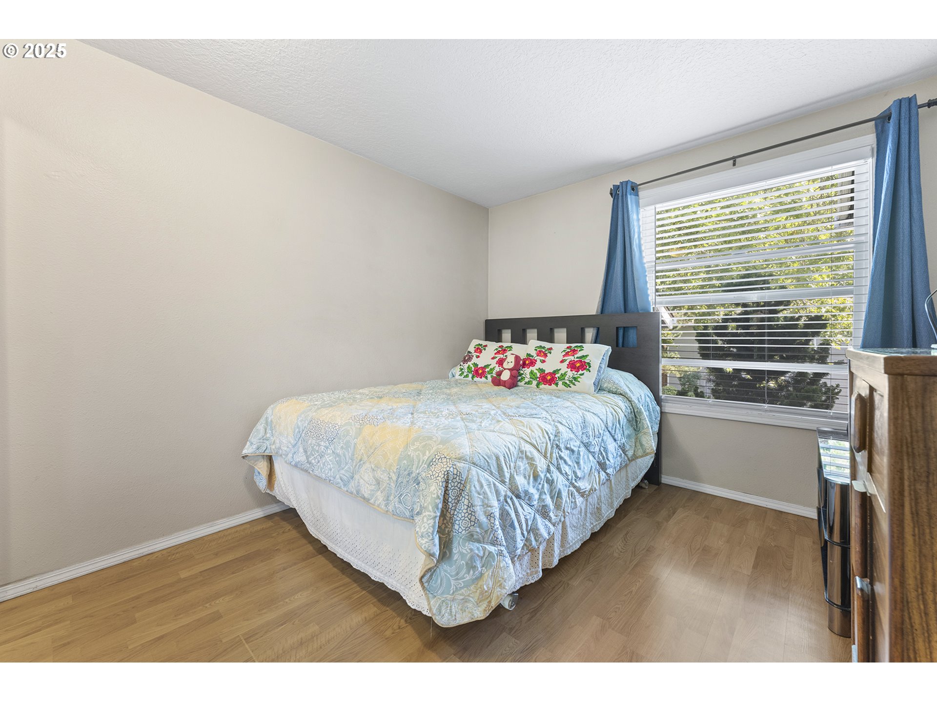 8512 Southwest Mohawk Street Tualatin, OR 97062 - Photo 17 of 33 a bedroom with a bed and a window