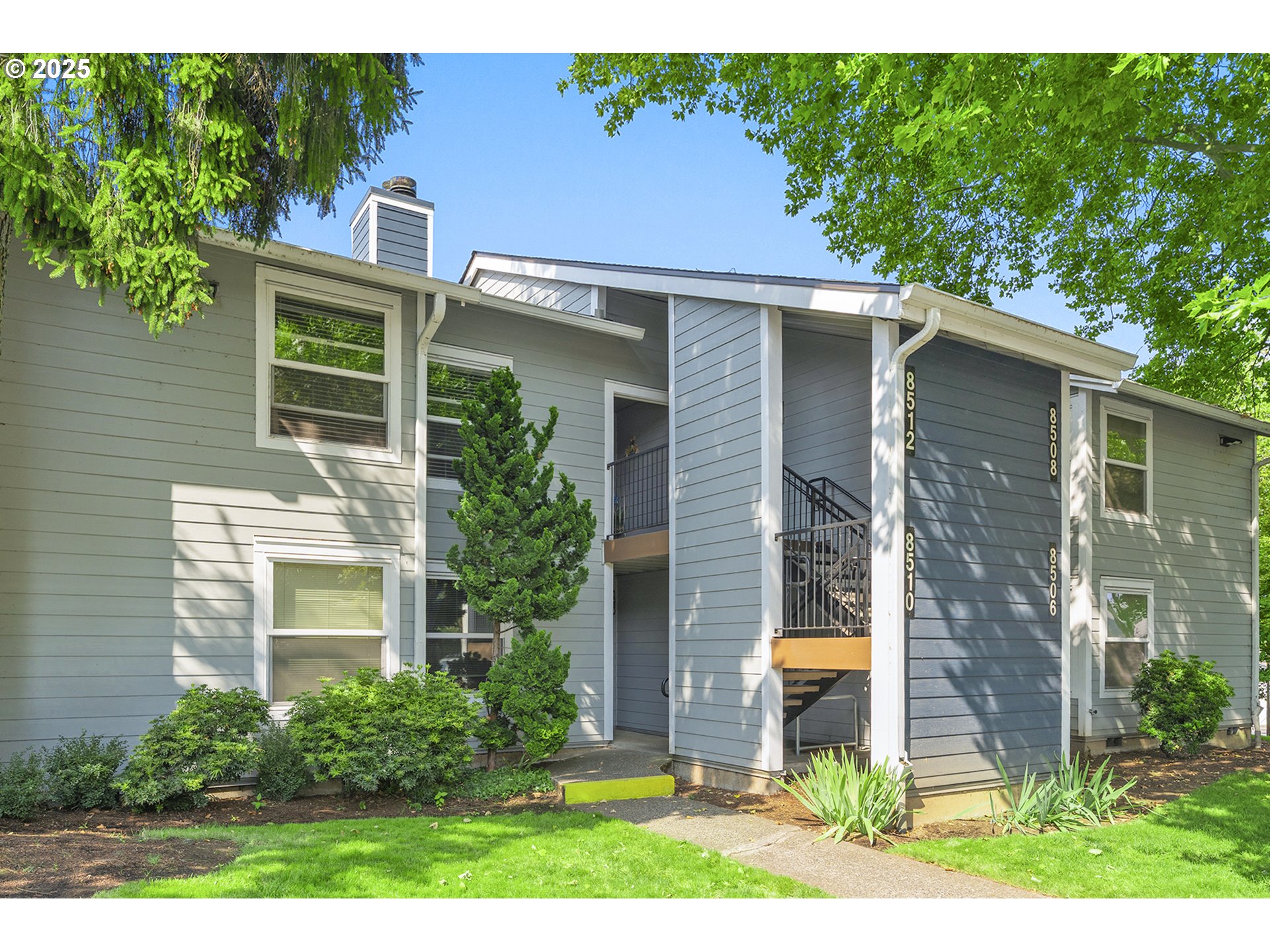 8512 Southwest Mohawk Street Tualatin, OR 97062 - Photo 2 of 33 a house view with a garden space