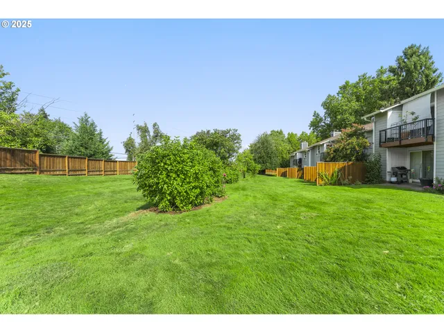 a view of a house with a big yard