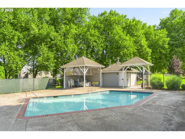 a view of a house with a yard patio and sitting area