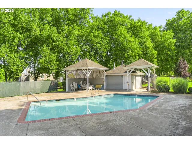 a view of a house with a yard patio and sitting area