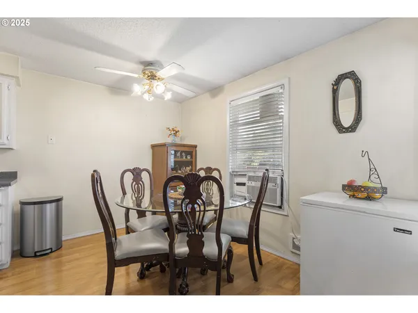 a dining room with furniture and window