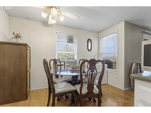 a dining room with furniture and window