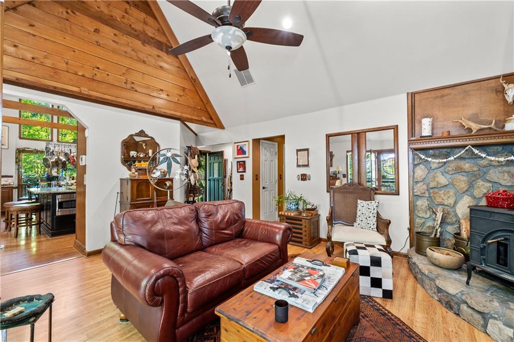 511 Oakdale Road Canton, GA 30114 - Photo 11 of 50 a living room with furniture a fireplace and a flat screen tv